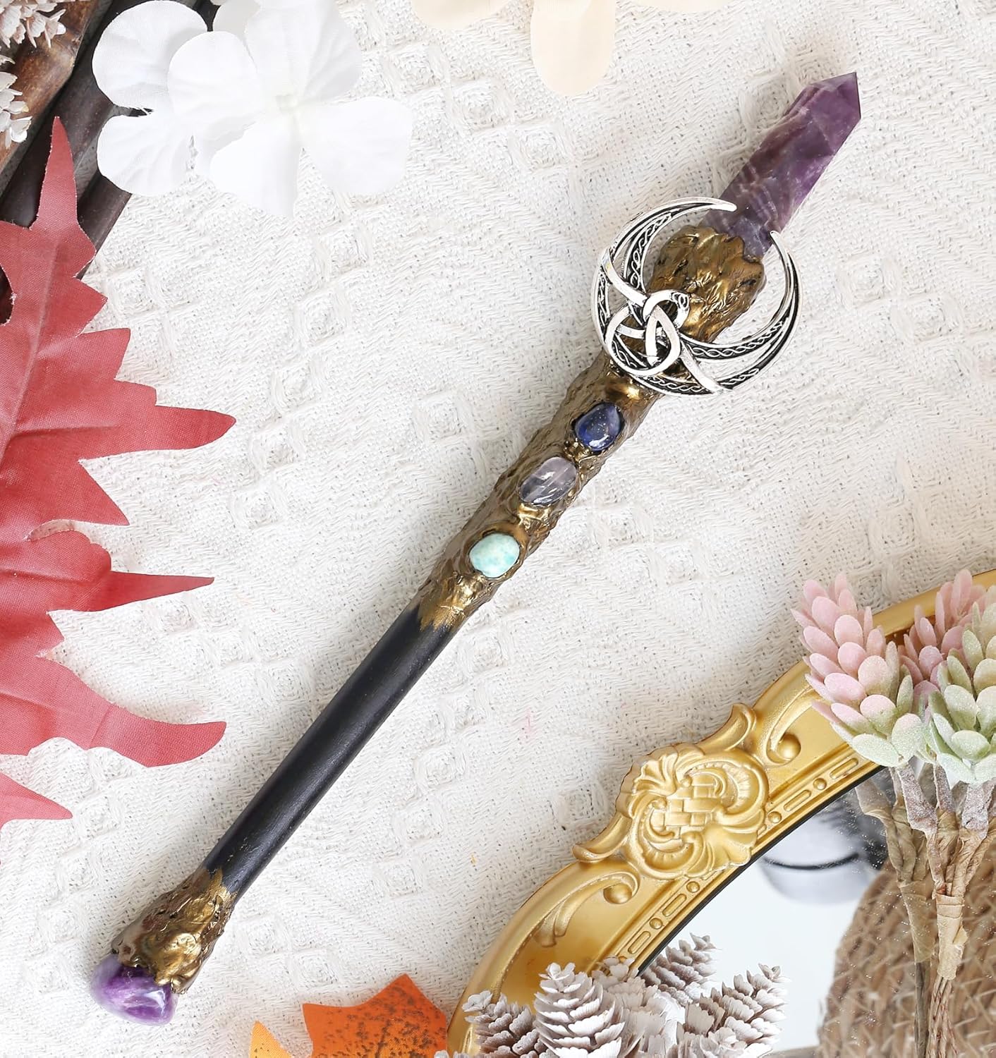 Handcrafted wooden wand, 9 inches, with a clear crystal point at the tip and a small crescent moon charm hanging from the upper shaft.